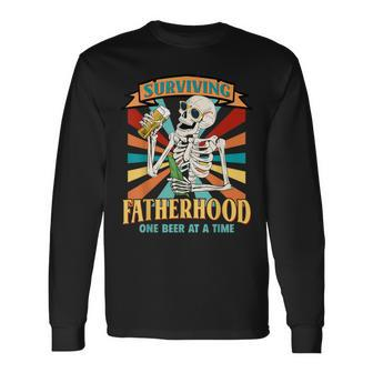 Surviving Fatherhood One Beer At A Time Skeleton Father Day Long Sleeve T-Shirt - Thegiftio UK