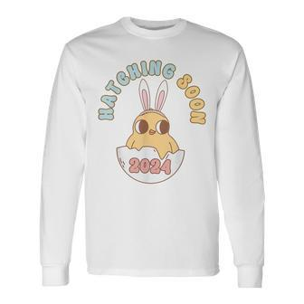 Groovy Hatching Soon Pregnancy Easter Pregnancy Announcement Long Sleeve T-Shirt - Seseable
