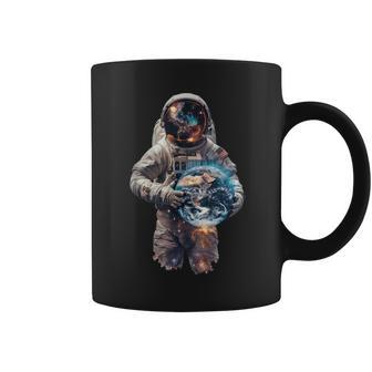 Astronaut Holds Earth In Space Coffee Mug - Monsterry AU