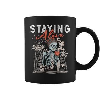 Staying Alive Skeleton Drinking Coffee Lover Addict Skull Coffee Mug - Monsterry