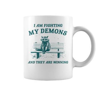 I Am Fighting My Demons Retro Cartoon Raccoon Meme Coffee Mug - Monsterry CA