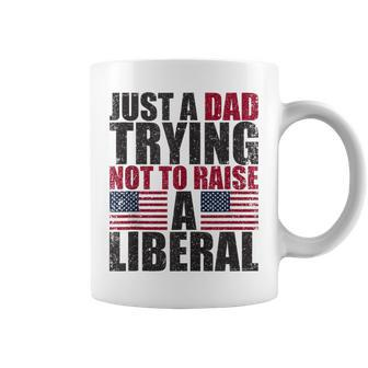 Just A Dad Trying Not To Raise A Liberal Coffee Mug - Seseable