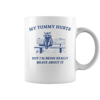 My Tummy Hurts Really Brave Raccoon Meme Mental Health Coffee Mug - Monsterry DE