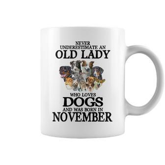 Never Underestimate An Old Lady Who Loves Dogs Born November Coffee Mug | Mazezy CA