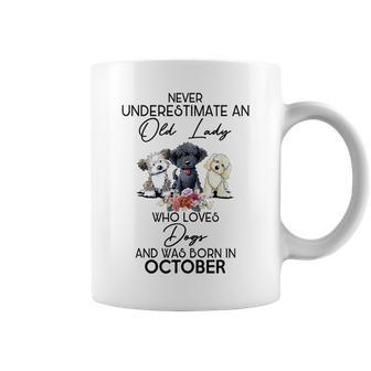 Never Underestimate An Old Lady Who Loves Dogs October Coffee Mug - Monsterry AU