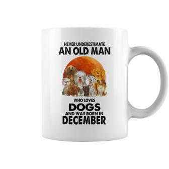 Never Underestimate An Old Man Who Loves Dogs Born December Coffee Mug - Monsterry CA