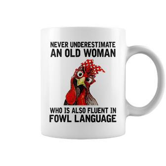 Never Underestimate An Old Woman Who Is Also Fluent Chickens Coffee Mug | Mazezy