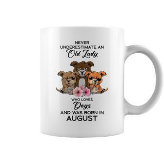 Never Underestimate An Old Woman Who Loves Dogs August Coffee Mug | Mazezy