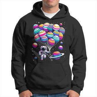 Astronaut Holding Planet Balloons Stem Science Hoodie - Monsterry
