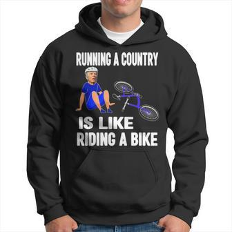 Biden Falls Off Bike Joe Biden Falling Off His Bicycle Hoodie | Mazezy