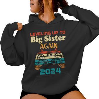 Retro Leveling Up To Big Sister Again 2024 Baby Announcement Women Hoodie - Monsterry AU