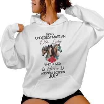 Never Underestimate An Old Lady Who Loves Horses July Women Hoodie | Mazezy