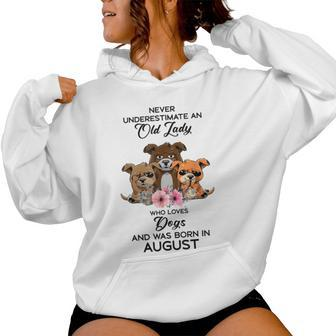 Never Underestimate An Old Woman Who Loves Dogs August Women Hoodie | Mazezy UK