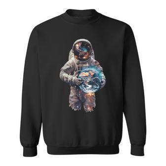 Astronaut Holds Earth In Space Sweatshirt - Monsterry DE