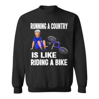 Biden Falls Off Bike Joe Biden Falling Off His Bicycle Sweatshirt | Mazezy DE
