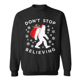 Christmas Bigfoot Dont Stop Believing Sasquatch Sweatshirt - Monsterry