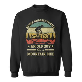 Never Underestimate An Old Guy On A Mountain Bike Sweatshirt - Seseable