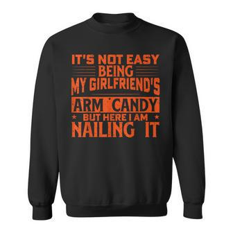 It's Not Easy Being My Girlfriend's Arm Candy Fathers Day Sweatshirt - Monsterry DE