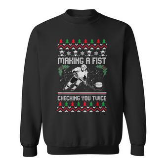 Making A Fist Checking You Twice Hockey Ugly Xmas Sweater Sweatshirt - Monsterry DE