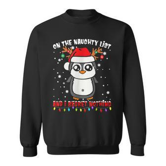 On The Naughty List And I Regret Nothing Penguin Xmas Sweatshirt - Monsterry