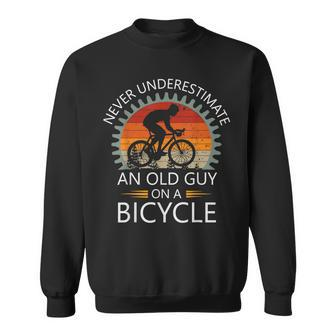 An Old Guy On A Bicycle Cycling Vintage Never Underestimate Sweatshirt - Thegiftio UK