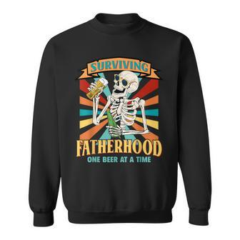 Surviving Fatherhood One Beer At A Time Skeleton Father Day Sweatshirt - Thegiftio UK