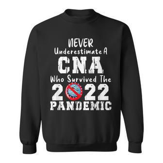 Never Underestimate A Cna Who Survived The 2022 Pandemic Sweatshirt - Thegiftio UK