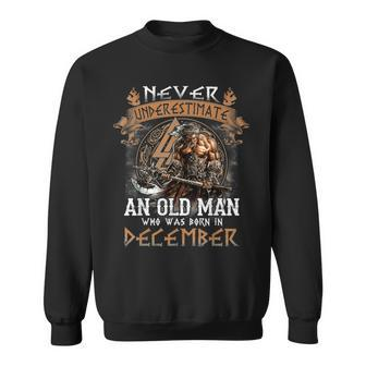 Never Underestimate An Old Man Who Was Born In December Sweatshirt - Seseable