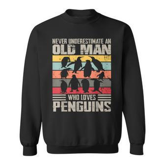 Vintage Never Underestimate An Old Man Who Loves Penguins Sweatshirt - Monsterry