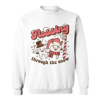 Flossing Through The Snow Dental Hygienist Christmas Dentist Sweatshirt - Monsterry