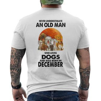 Never Underestimate An Old Man Who Loves Dogs Born December Men's T-shirt Back Print - Monsterry