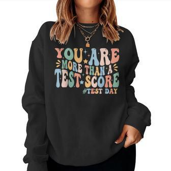 Groovy You Are More Than A Test Score Teacher Testing Day Women Sweatshirt - Seseable