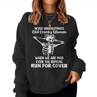 Never Underestimate Old Cranky Skeleton Women Sweatshirt - Monsterry DE