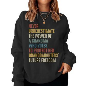 Never Underestimate The Power Of A Grandma Who Votes Women Sweatshirt - Seseable