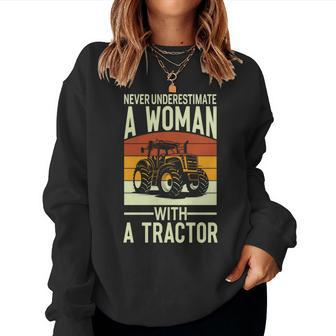 Never Underestimate A Woman With A Tractor Farmer Women Sweatshirt - Seseable