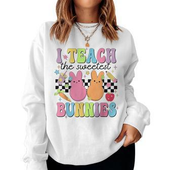I Teach The Sweetest Bunnies Teacher Easter Day Women Sweatshirt - Seseable