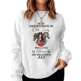Never Underestimate An Old Lady Who Loves Horses July Women Sweatshirt | Mazezy