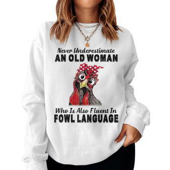 Never Underestimate An Old Woman Fluent In Fowl Language Women Sweatshirt - Monsterry AU