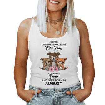 Never Underestimate An Old Woman Who Loves Dogs August Women Tank Top | Mazezy UK