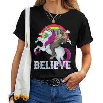 Bigfoot Riding Unicorn Rainbow Sasquatch Believe Women T-shirt - Monsterry DE