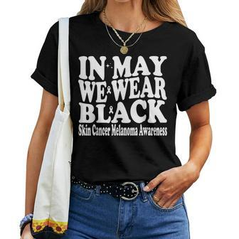In May We Wear Black Skin Cancer Melanoma Awareness Groovy Women T-shirt - Monsterry