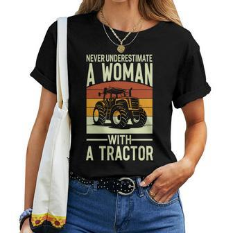 Never Underestimate A Woman With A Tractor Farmer Women T-shirt - Seseable
