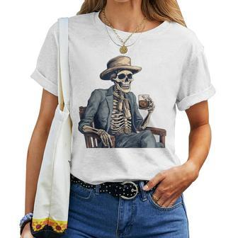 Cowboy Skeleton Drinking Whiskey Western Outlaw Skull Saloon Women T-shirt - Monsterry CA