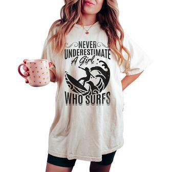 Big Wave Surfing Girls Never Underestimate A Girl Who Surfs Women's Oversized Comfort T-shirt | Mazezy