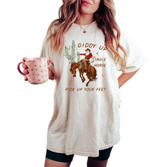 Giddy Up Jingle Horse Pick Up Your Feet Cowboy Santa Cactus Women's Oversized Comfort T-shirt | Mazezy