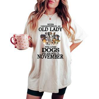 Never Underestimate An Old Lady Who Loves Dogs Born November Women's Oversized Comfort T-shirt | Mazezy DE