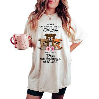 Never Underestimate An Old Woman Who Loves Dogs August Women's Oversized Comfort T-shirt | Mazezy UK