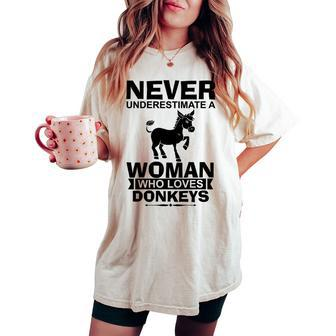 Never Underestimate A Woman Who Donkey Lover Women's Oversized Comfort T-shirt - Seseable