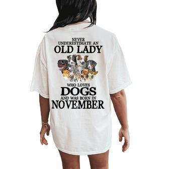 Never Underestimate An Old Lady Who Loves Dogs Born November Women's Oversized Comfort T-Shirt Back Print | Mazezy CA