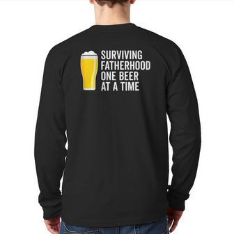 Mens Surviving Fatherhood One Beer At A Time Cool Fathers Day Back Print Long Sleeve T-shirt | Mazezy